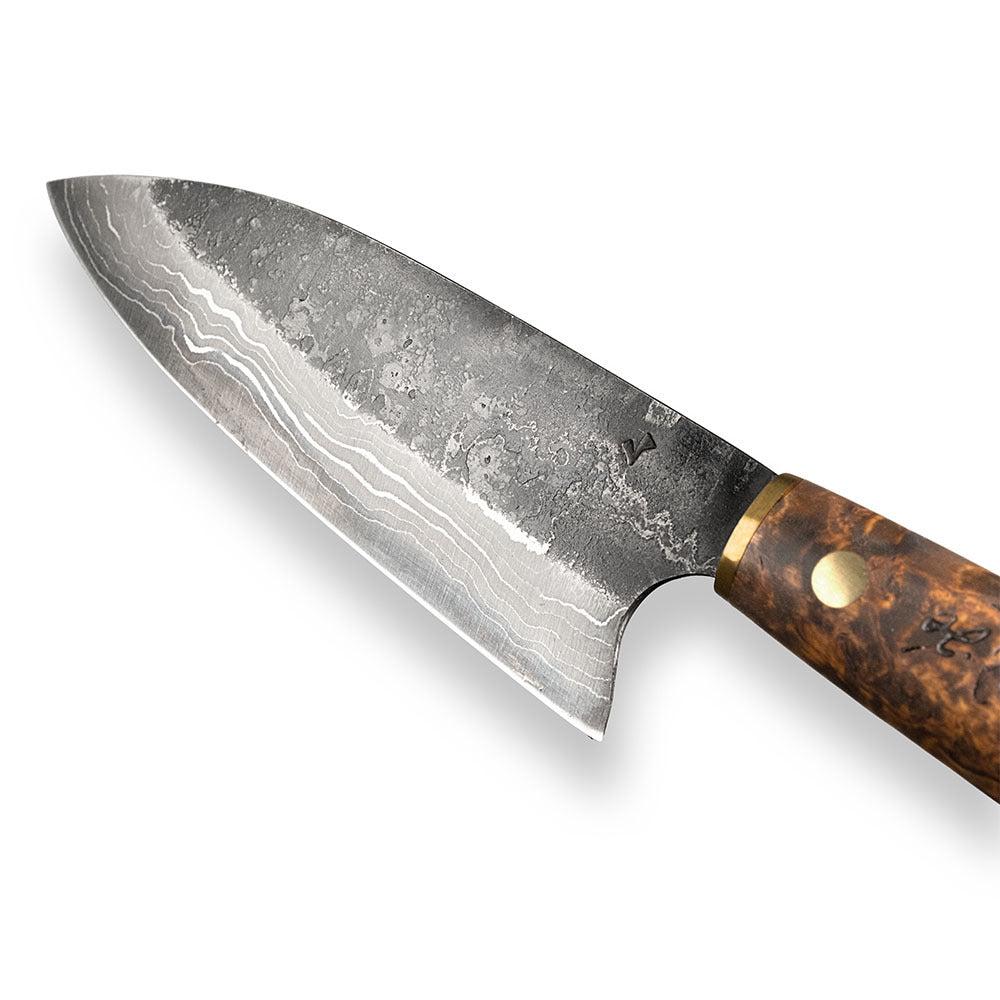 Handmade Damascus steel kitchen knife made by hand in our factory in Finland. The Damascus steel has 37 layers of steel. Comes with a handle made from stained curly birch and a handmade leather sheath.