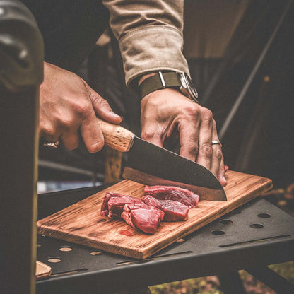 Roselli's handmade Finnish kitchen knife for chefs in carbon steel and a handle made from curly birch. Delivers with a handmade leather sheath. Perfect for both the outdoor and indoor kitchen.